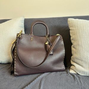 Pre- loved Coach Rogue with Rivets